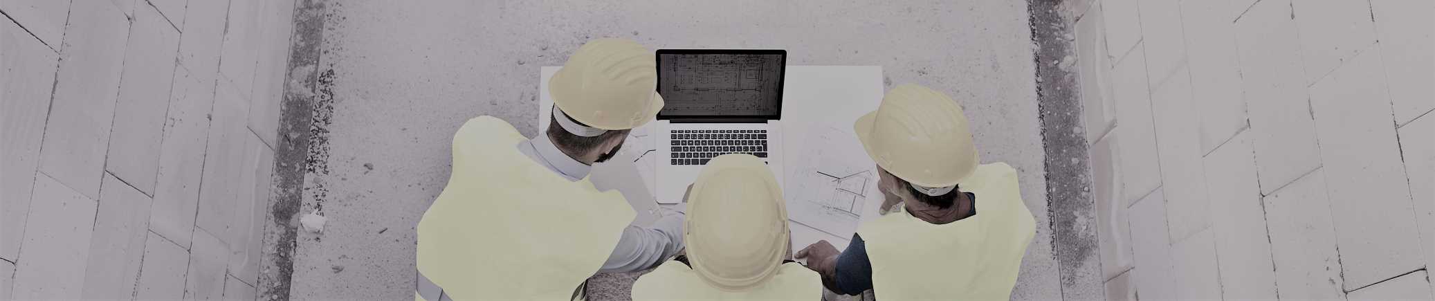 Preparing to Build architects on site reviewing plans